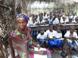 Students in classroom with teacher, DRC