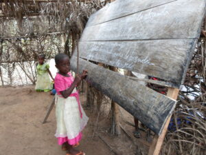 Little girl at chalk board, DRC