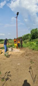 Solar-powered light post installation